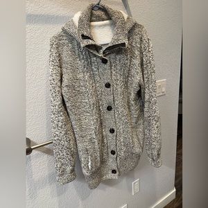 Warm, fuzzy, Shacket. Has zipper and buttons.